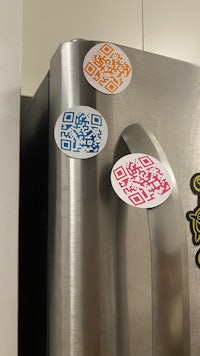 qr code stickers on a refrigerator